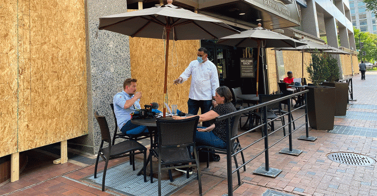 Diners-outside-a-boarded-up-restaurant_1.gif