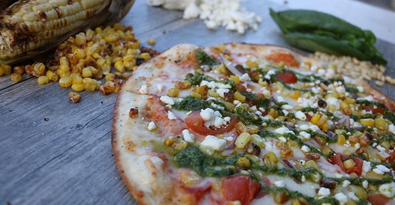 Item Pesto Primavera pizza pizza crust topped with red sauce allnatural Italian cheese roasted corn crumbled goat cheese red onion cherry tomatoes and a pesto drizzle under 600 calories 825Availability Through March 31