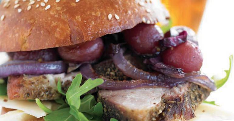 Slow-Roasted Porchetta Sandwich with Roasted Grapes, Red Onion and Asiago