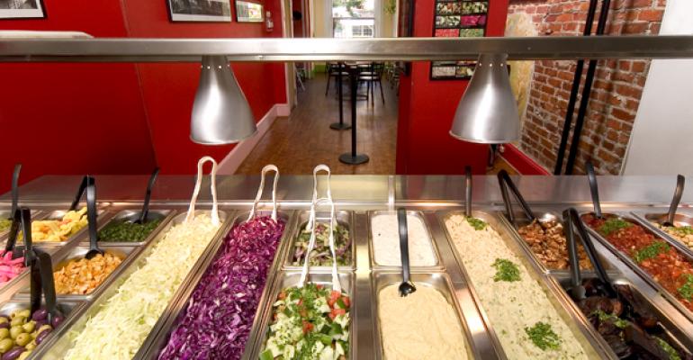 Falafelshop39s garnishing station lets diners customize their order