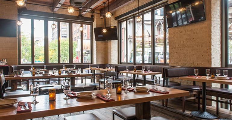 Community tables are becoming more prevalent as restaurants cater to Millennials who enjoy sharing their experiences with others designers say