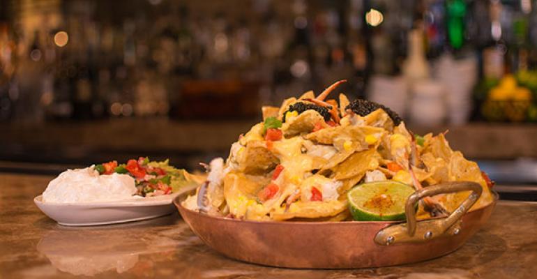Brennanrsquos of Houston will offer the overthetop Blue Crab and Caviar Nachos 100 featuring Fire Roasted Corn St Andre Queso Alligator Pear avocado Mirliton Pico de Gallo and crowned with an ounce of Petrossian caviar