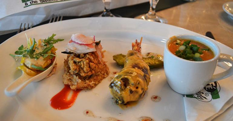 A sampling of the seafood small plates at Cafeacute Adelaide on Poydras St Left to right shrimp remoulade Gulf oysters with cochon de lait tamale grits a shrimp amp tasso quotcorndogquot with fivepepper jelly and redfish and white bean soup 