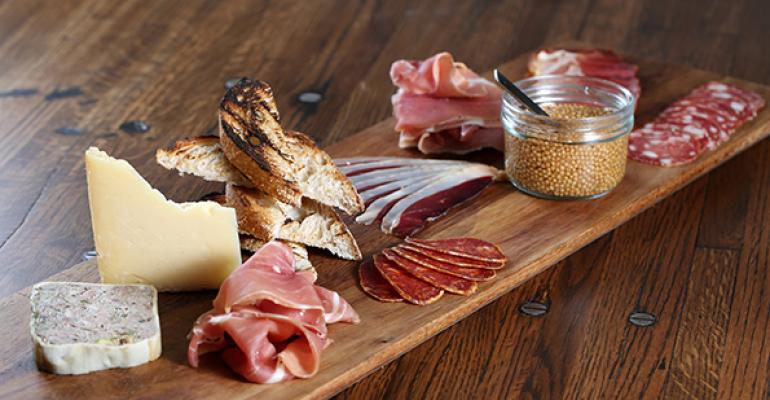 The casual dining concept Saltwood in Loews Atlanta Hotel offers rustic presentations including wood blocks that emphasize the restaurantrsquos salted cured meats and charcuterie plates