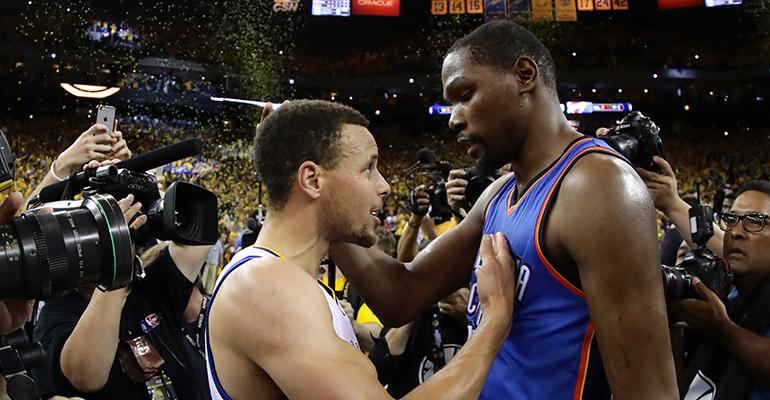 In joining Stephen Curry left and the Warriors Kevin Durant leaves an angry community in his wake