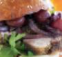SlowRoasted Porchetta Sandwich with Roasted Grapes Red Onion and Asiago