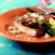 Swordfish with Fried Yam Patties, Wisconsin Gruyere Creme and Cotija Crumbles