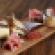 The casual dining concept Saltwood in Loews Atlanta Hotel offers rustic presentations including wood blocks that emphasize the restaurantrsquos salted cured meats and charcuterie plates