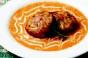 Maryland-Style Crab Cake Appetizer Over Red Pepper Cream Sauce